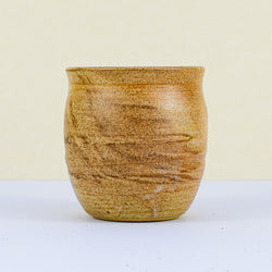 Handmade clay cup front view